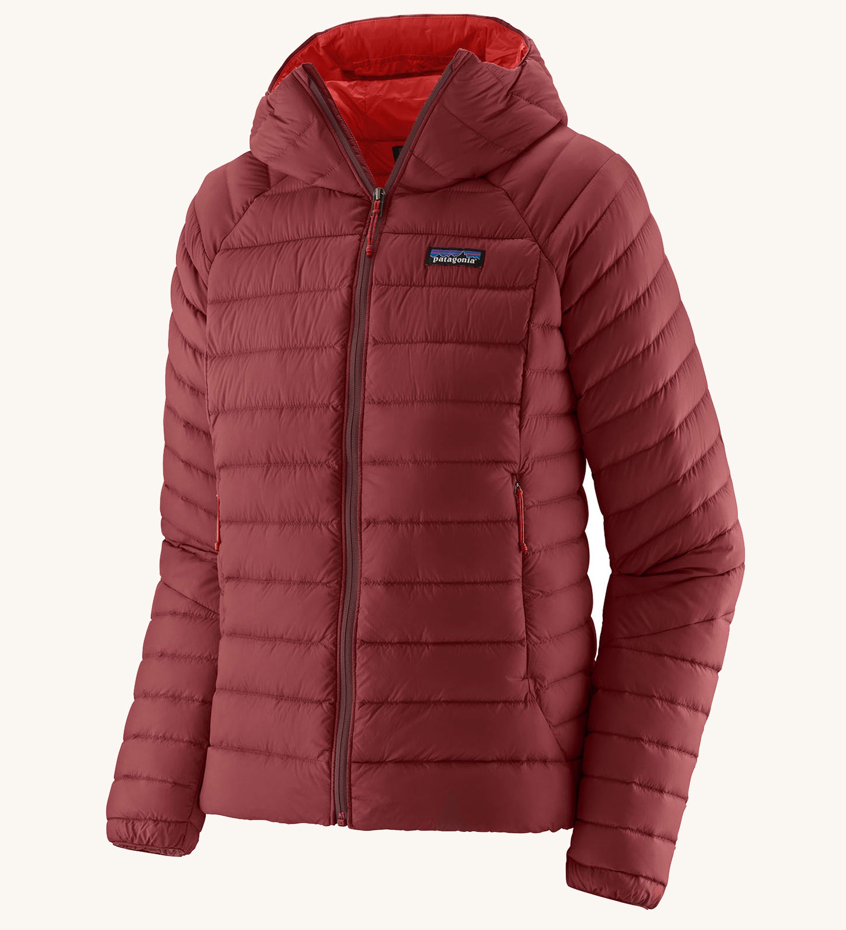 Patagonia Women's Down Sweater Hoody in a Oxide Red colour on a plain bacnground. 