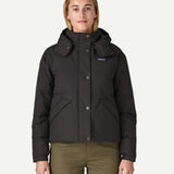 A woman wearing the Patagonia women's downdrift jacket in black to showcase the fit and recycled fabric.