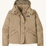 Patagonia Women's Downdrift Jacket Jacket in an Oar Tan Seabird Grey colour. We have a wide range of Patagonia adult's and children's coats and clothing at Babipur.