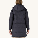 The back of a woman wearing the Patagonia Women's Downdrift Parka Jacket in a Sunken Blue colour.