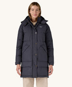 A woman wearing the Patagonia Women's Downdrift Parka Jacket in a Sunken Blue colour.