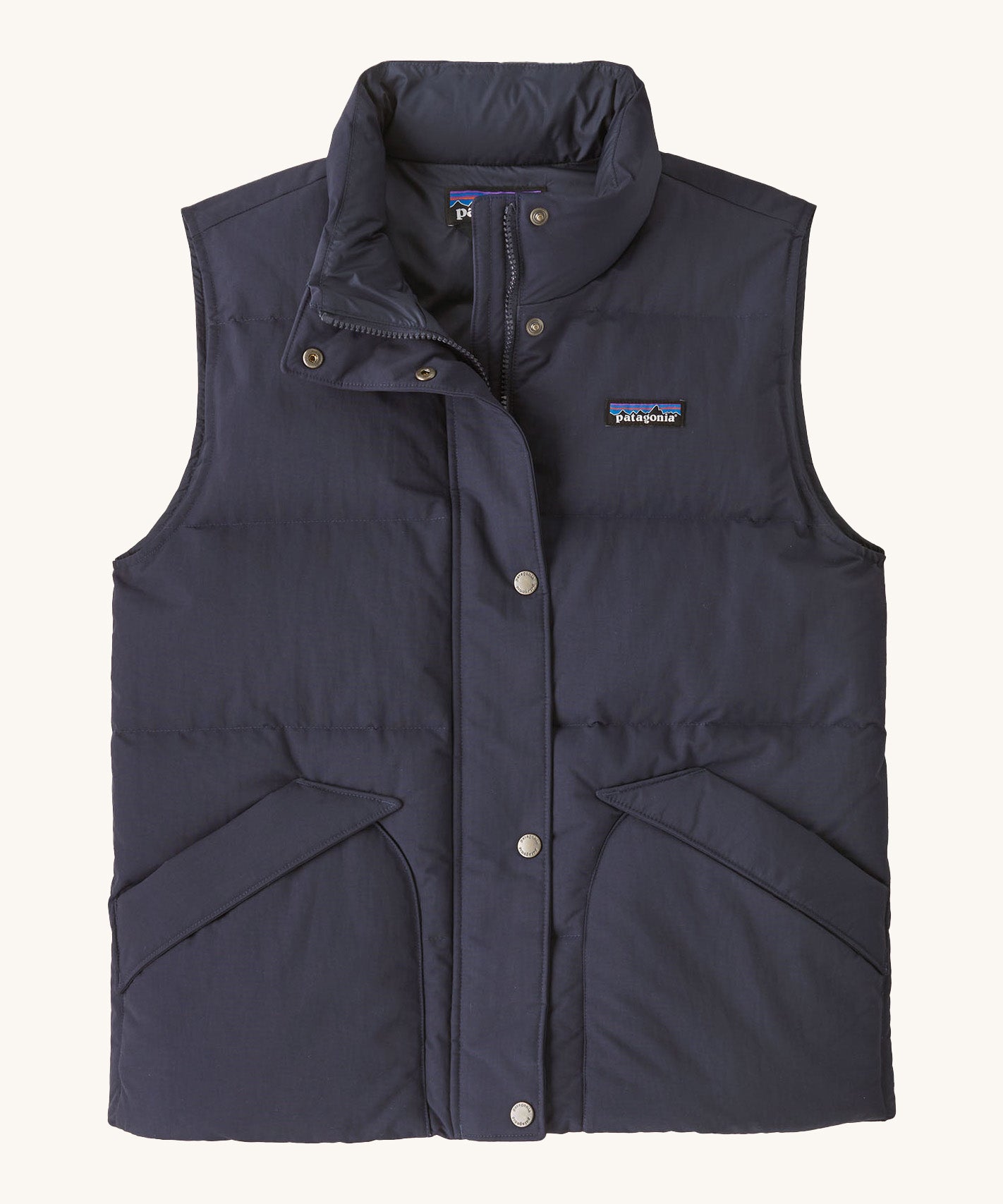 Patagonia womens downdift vest. A blue sleeveles gilet with a full length zip and button fastener. Features 2 side pockets and a logo patch stitched on the left chest.