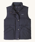 Patagonia womens downdift vest. A blue sleeveles gilet with a full length zip and button fastener. Features 2 side pockets and a logo patch stitched on the left chest.