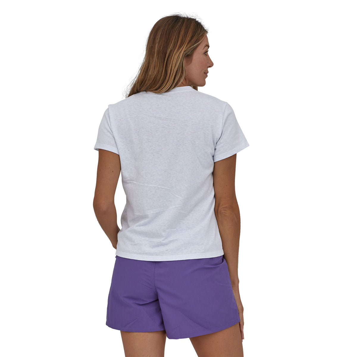 woman wearing the Woman wearing Patagonia Women's Endure Hex Responsibili-Tee in white colour way  showing the back of the top