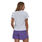 woman wearing the Woman wearing Patagonia Women's Endure Hex Responsibili-Tee in white colour way  showing the back of the top