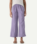 Front view of a model wearing Patagonia Women’s Outdoor Everyday Pants in purple to show fit, featuring a high-rise elasticated waist and wide-leg cropped silhouette falling above the ankles.