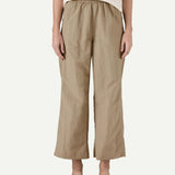 Closer front view of a model wearing Patagonia Women’s Outdoor Everyday Pants in Seabird Grey, showing a high-rise elasticated waistband and wide-leg cropped fit falling above the ankles.