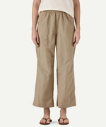 Closer front view of a model wearing Patagonia Women’s Outdoor Everyday Pants in Seabird Grey, showing a high-rise elasticated waistband and wide-leg cropped fit falling above the ankles.