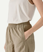 Close-up side view of Patagonia Women’s Outdoor Everyday Pants in Seabird Grey, showing the elasticated waistband, side-entry pocket, and lightweight nylon fabric texture.