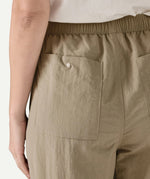 Close-up of the back of Patagonia Women’s Outdoor Everyday Pants in Seabird Grey, showing a rear patch pocket with snap closure and elasticated waistband.