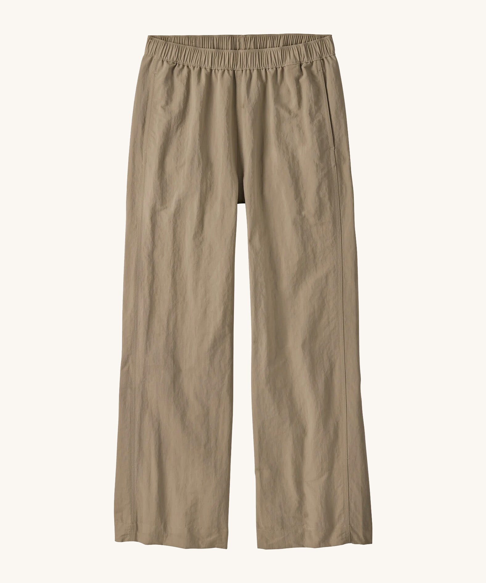 Flat lay front view of Patagonia Women’s Outdoor Everyday Pants in Seabird Grey, showing the wide-leg cropped shape and elasticated waistband on a light background.