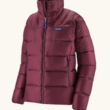 Patagonia women's fitz roy down insulated lightweight windproof jacket in berry fig. Two zippered hand warmer pockets.