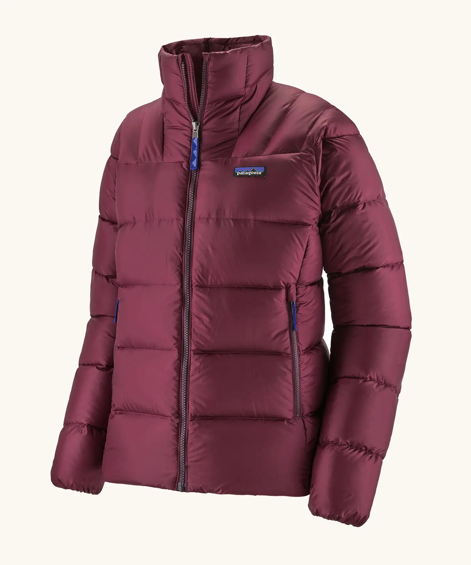 Patagonia women's fitz roy down insulated lightweight windproof jacket in berry fig. Two zippered hand warmer pockets.