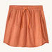 Patagonia women's fleetwith skort in a coral colour with flower design on a cream background.