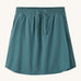 Patagonia women's fleetwith skort in a teal colour on a cream background.