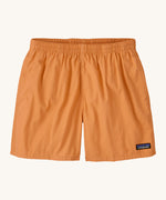 Patagonia women's funhogger shorts in dark peach on a cream background.