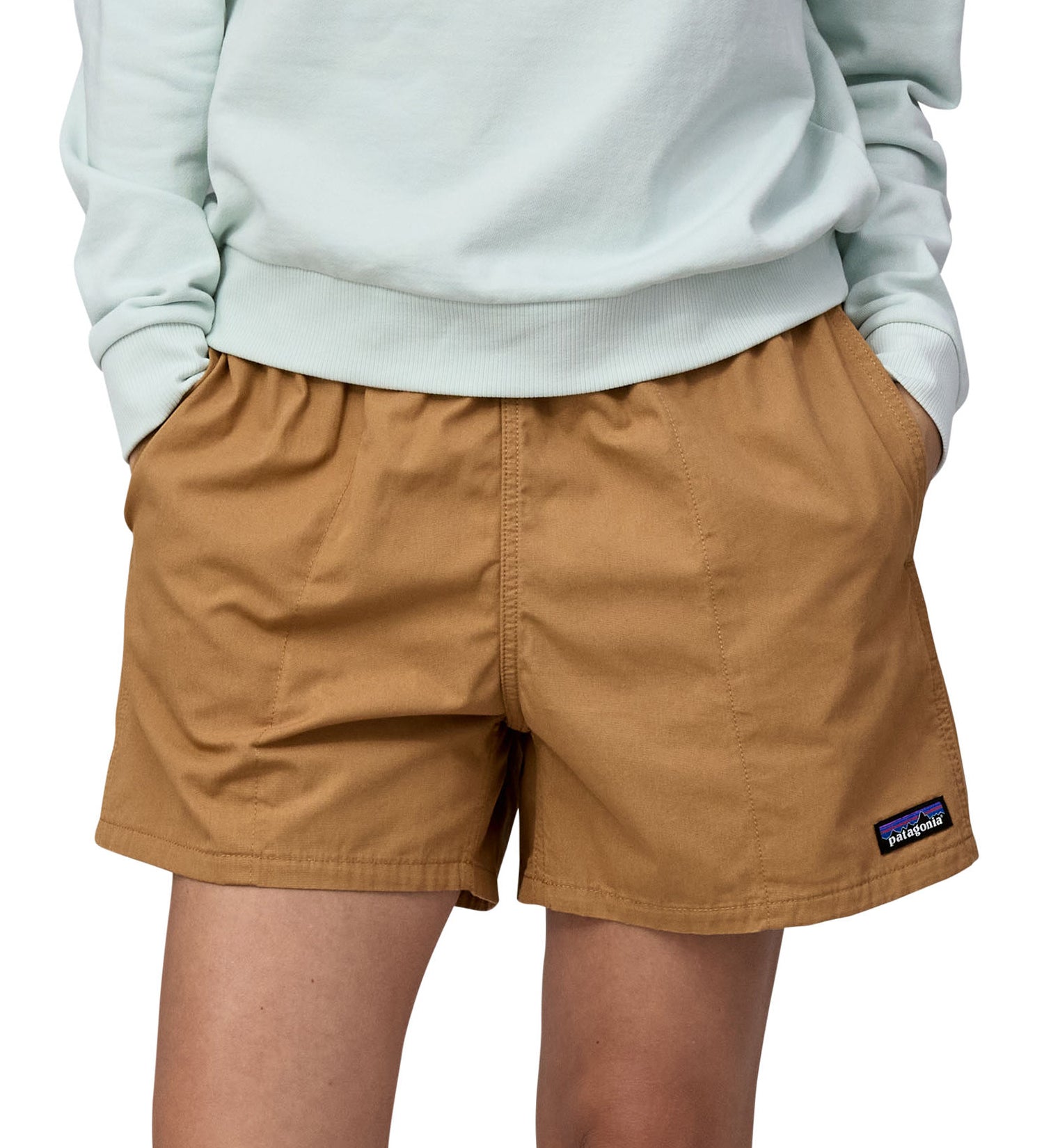Patagonia women's funhogger shorts in brown worn by a woman front detail