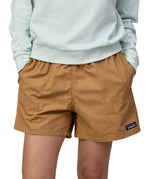 Patagonia women's funhogger shorts in brown worn by a woman front detail
