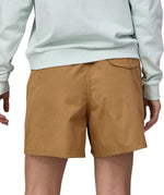 Patagonia women's funhogger shorts in brown worn by a woman back detail