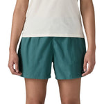 Patagonia Women’s Funhoggers™ Shorts Wetland Blue relaxed fit on model, falling high on the thigh, where fingertips reach