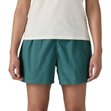 Patagonia Women’s Funhoggers™ Shorts Wetland Blue relaxed fit on model, falling high on the thigh, where fingertips reach