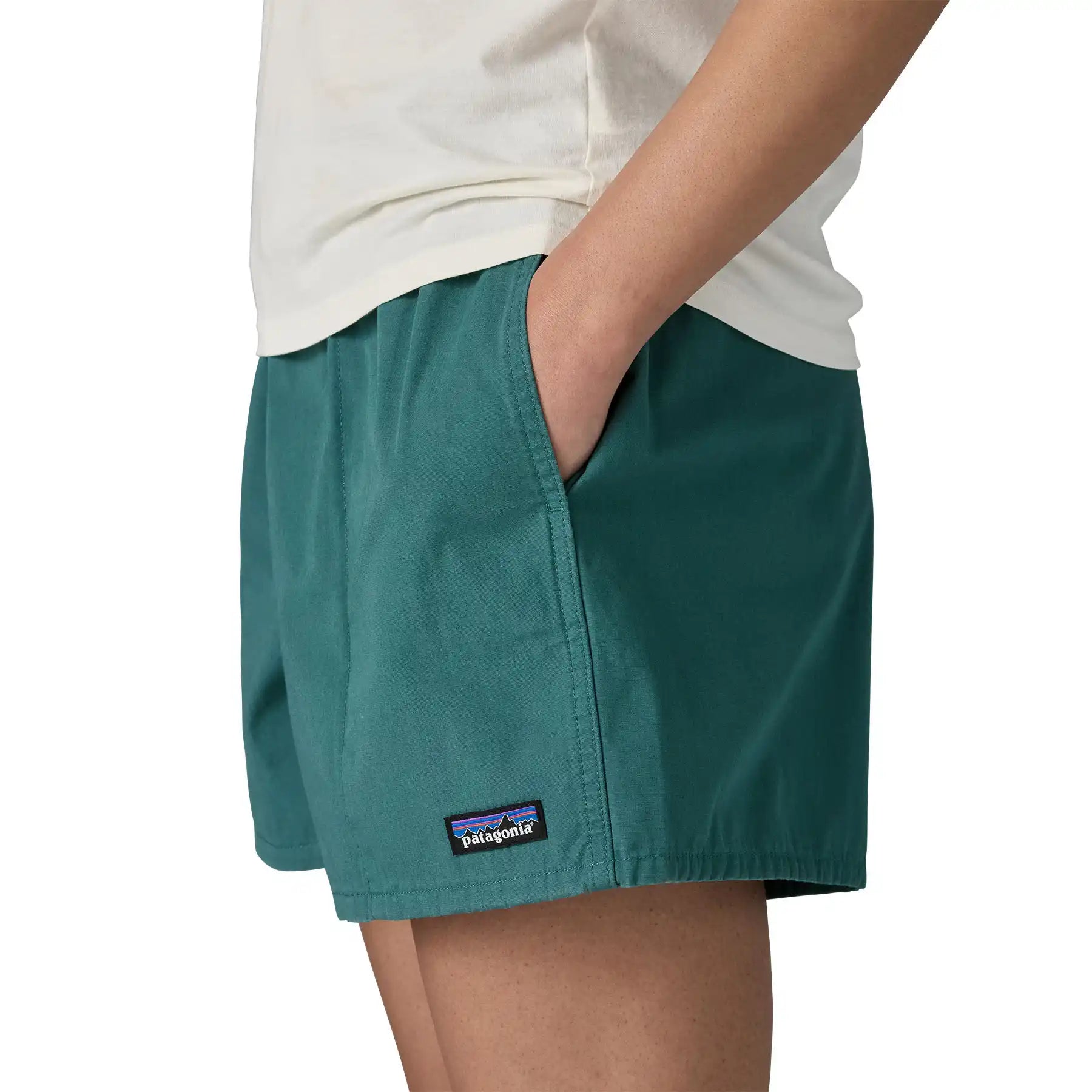 Patagonia Women’s Funhoggers™ Shorts Wetland Blue side view with hand in pocket and P-6 logo