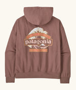Back of the Patagonia women's great waves daily hoody in moonrise taupe. Large Patagonia logo on the back surrounded by waves and great pacific and iron works in sign style text. 