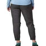 Patagonia women's hampi rock pants in regular ink black being worn. The length reaches just above the ankle.