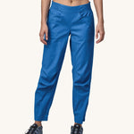 A person wearing a pair of Patagonia Women's Hampi Rock Pants in a blue colour.