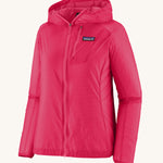 Patagonia womens houdini jacket in pink on a cream background.