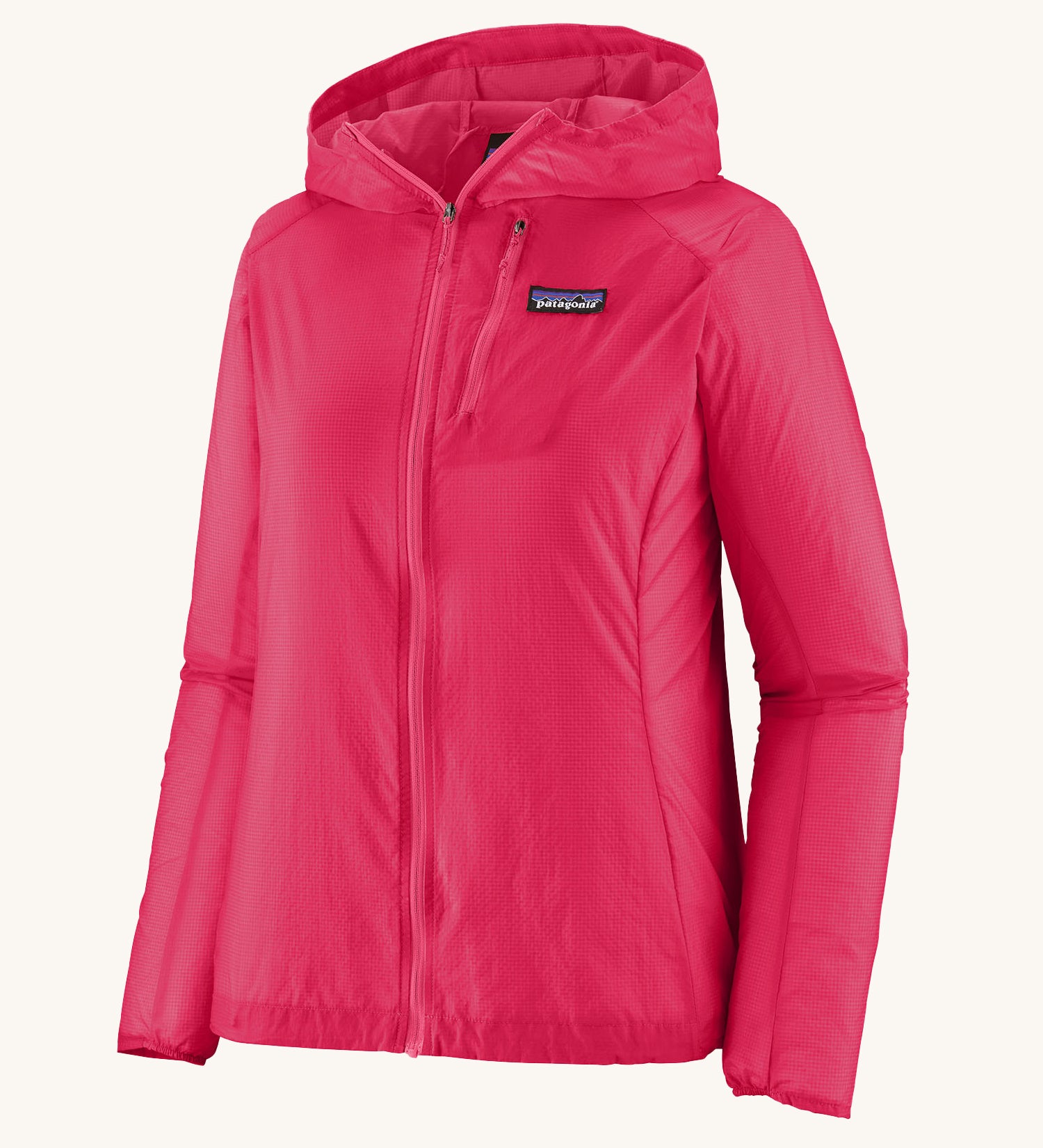 Patagonia womens houdini jacket in pink on a cream background.