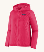 Patagonia womens houdini jacket in pink on a cream background.