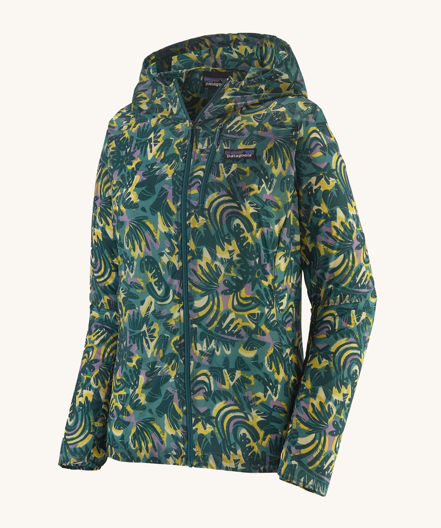 Patagonia women's houdini jacket in a turquoise colour with a retro flower design on a cream background.
