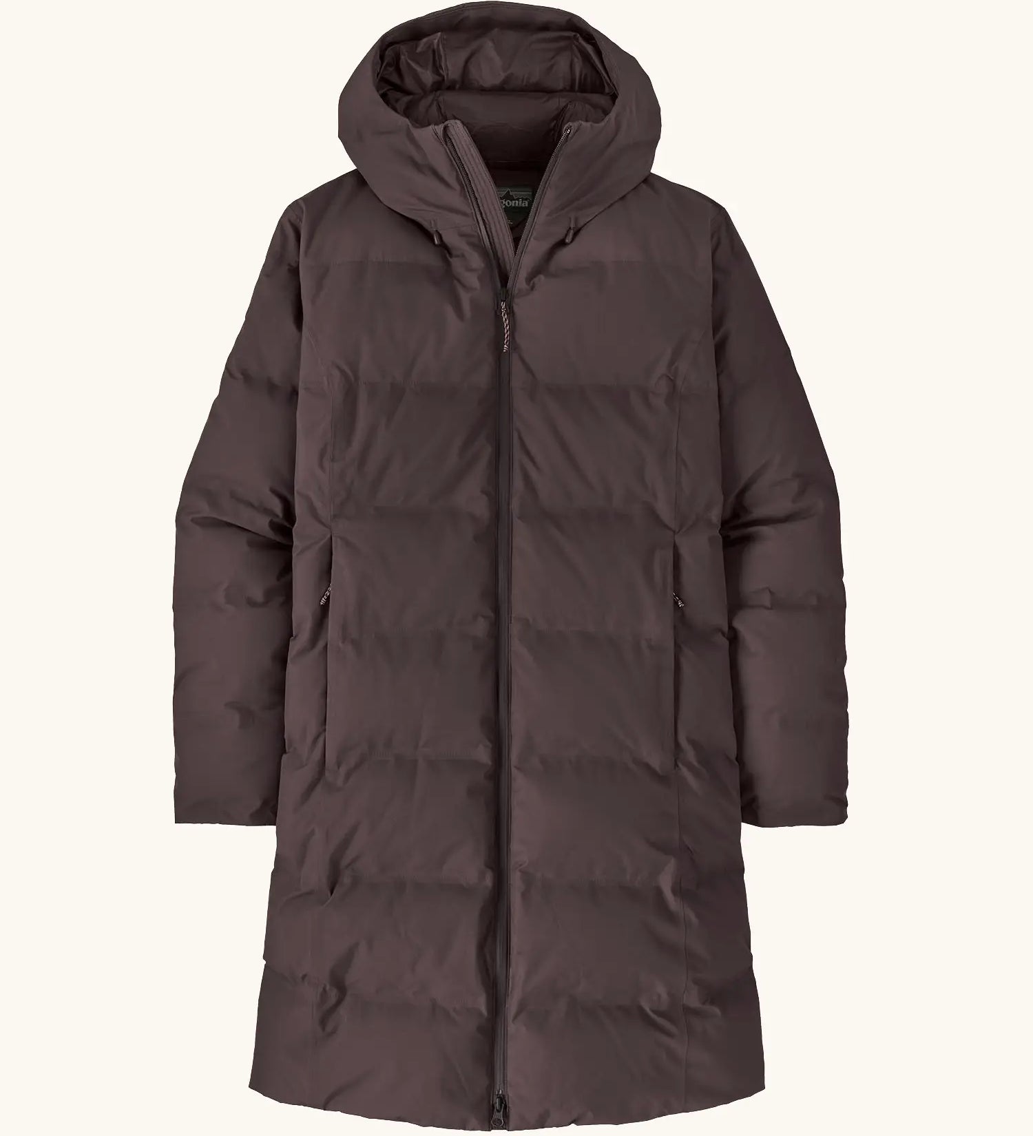 Patagonia women's waterproof jackson glacier parka in den brown with a water-resistant two-way front zip, insulated  fixed hood and two high-volume handwarmer pockets.