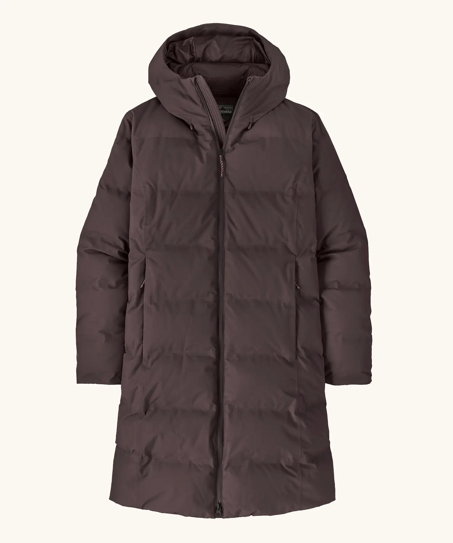 Patagonia women's waterproof jackson glacier parka in den brown with a water-resistant two-way front zip, insulated  fixed hood and two high-volume handwarmer pockets.