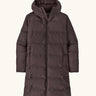 Patagonia women's waterproof jackson glacier parka in den brown with a water-resistant two-way front zip, insulated  fixed hood and two high-volume handwarmer pockets.