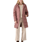 Woman wearing Patagonia Jackson Glacier Parka Coat in pink with the zip open and walking clothing underneath.
