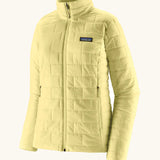 Patagonia women's lightweight nano puff insulated jacket in light vellum green with zippered handwarmer pockets.
