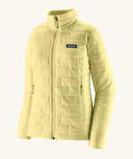 Patagonia women's lightweight nano puff insulated jacket in light vellum green with zippered handwarmer pockets.