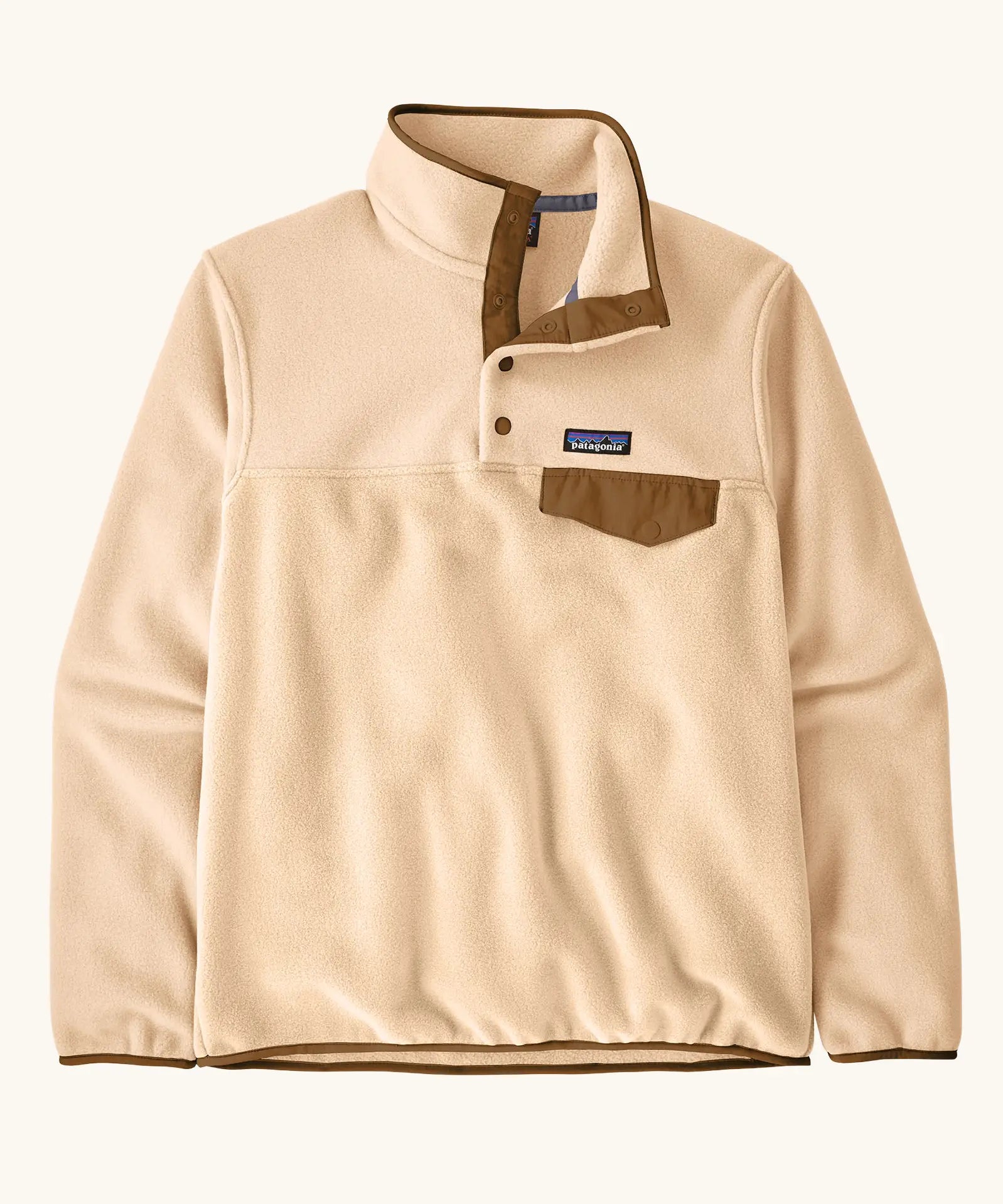 Patagonia women's lightweight synchilla fleece snap-t pullover in natural with brown chest pocket and bininding in sleeves and collar.