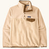 Patagonia women's lightweight synchilla fleece snap-t pullover in natural with brown chest pocket and bininding in sleeves and collar.