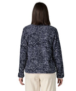 Back of woman wearing the Patagonia women's lightweight synchilla fleece snap-T pullover with a saxifrage pattern in a sunken blue colour. 