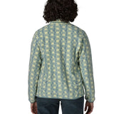 Woman wearing the Patagonia women's lightweight synchilla fleece snap-T pullover in a sun Quilt pattern in blue sage, view of back