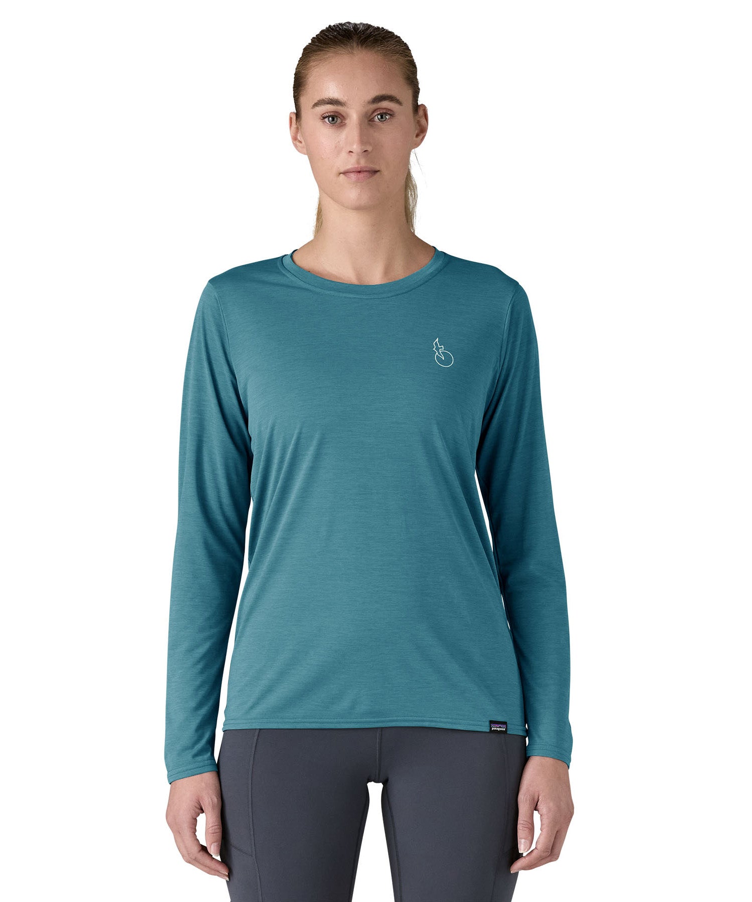 Patagonia women's long sleeve capilene top in turquoise beach outline design worn by a woman front detail