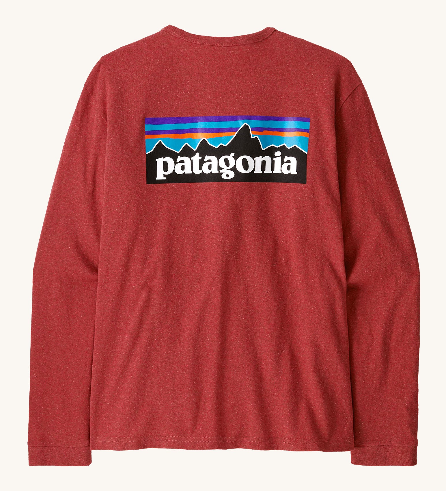 Patagonia women's responsibilli top in potters red. A long sleeve top with a large brand patch printed on the back 