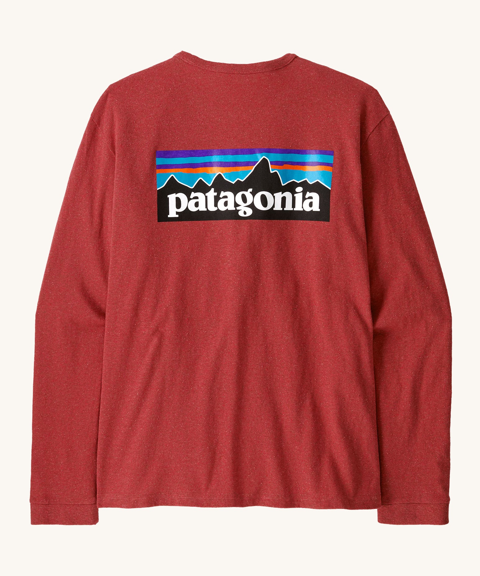 Patagonia women's responsibilli top in potters red. A long sleeve top with a large brand patch printed on the back 
