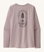 The back of the Patagonia Women's Long-Sleeved Capilene Cool Shirt with a  Clean Climb Bloom graphic in an Echo Purple colour.
