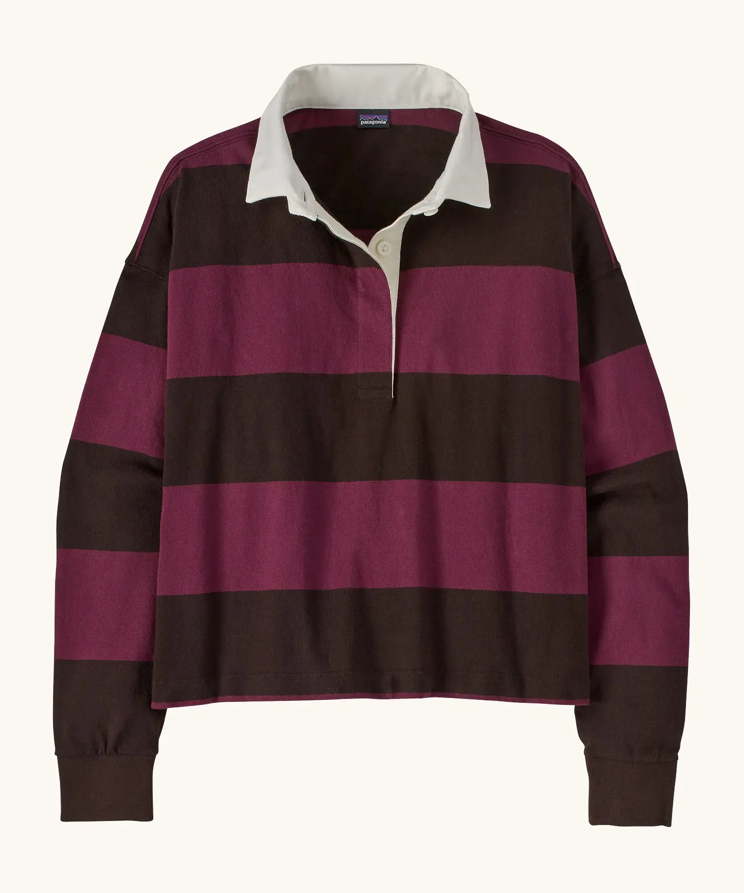 Patagonia women's long sleeved cotton rugby shirt in wide stripe berry fig with white collar.