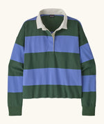 Patagonia women's long sleeved cotton rugby shirt in wide stripe diver blue with white collar.