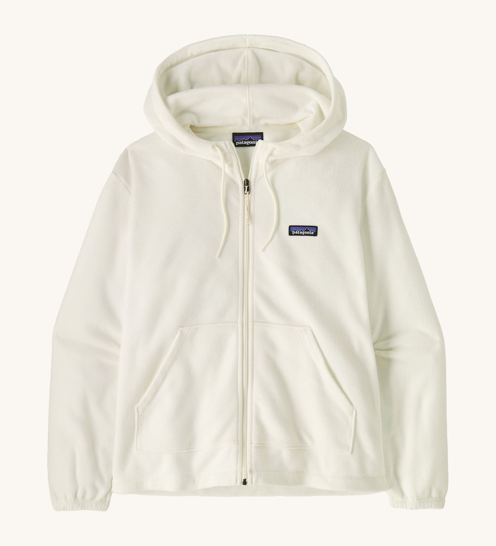 Patagonia women's micro fleece hooded jacket in white on a cream background.